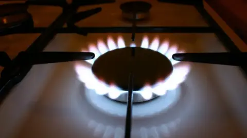 A close up of a lit gas hob