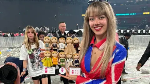 Steve Siegert Ellen Siegert dress in a red, white and blue dress with woolen figures