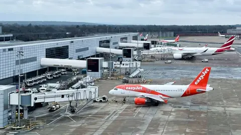 Getty Images Several EASYJET airline airliners are parked on the airport tarmac waiting to be ready to take off from London Gatwick 