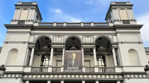 A theatre with a picture of a man in jail