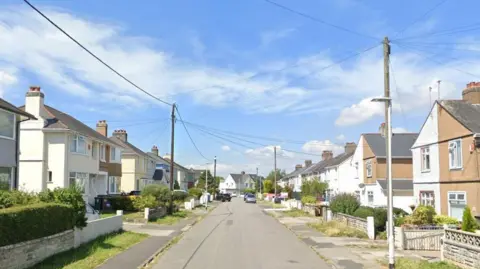 King's Road in Plymouth, showing a residential street with houses on each side of the road and cars parked on the street. 