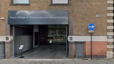 Google London street building, showing an entrance with "Royal College of Obstetricians and Gynaecologists" on a grey sign above. The number 10 is displayed on the brick wall on either side of the entrance and there is a one-way sign to the right.