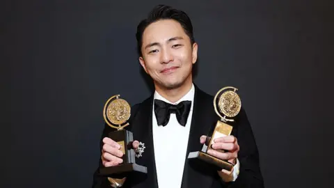 Hue Park poses with the Best Score award and Best Book of a Musical award for "Maybe Happy Ending" in The 78th Annual Tony Awards Media Room