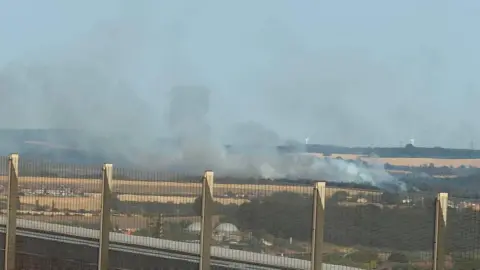 Smoke on fields seen from a distance