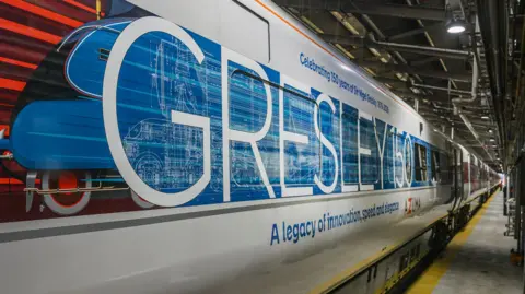 LNER An Azuma train in LNER livery with the word Gresley painted on it in blue