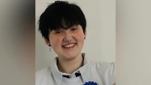 Family photo Finn Hall smiling 