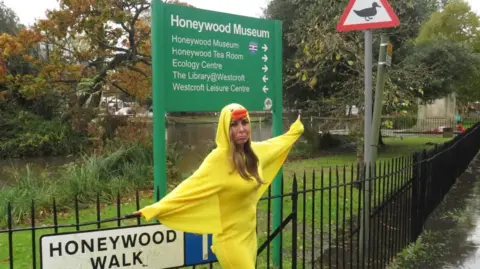 Friends of Carshalton Ponds Saffron next to the animal crossing sign