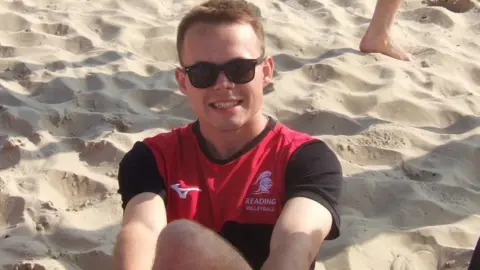 Cian Everett sat on a beach.