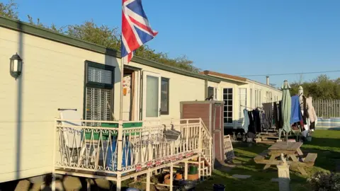 A caravan site on the Isle of Sheppey, with a Union Jack flag flying outside one.