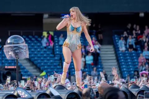 PA Media Taylor Swift on stage at Murrayfield Stadium in Edinburgh 