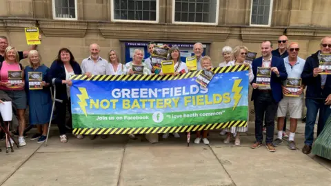 LDRS The I Love Heath Common group pictured outside Wakefield Town Hall ahead of a planning committee meeting on July 17. Councillors rejected proposals for a battery energy storage system (BESS) near to the village.
