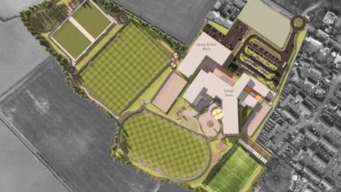 Illustration of the plans for the footprint of the new Castle Rushen High School including green sports fields and beige and cream coloured school buildings. The surrounding fields and housing is in grey.
