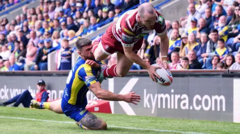 Liam Marshall scores for Wigan Warriors against Warrington Wolves