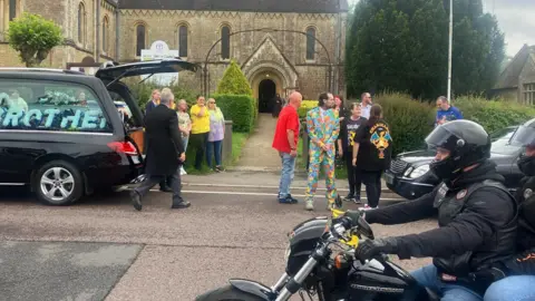 The hearse arriving at the church in DIlton Marsh