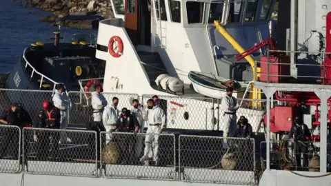 BBC The first irregular migrants arrived on board the Italian navy ship Libra 