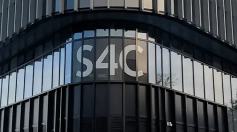 The S4C logo on the outside of its headquarters on a black building.