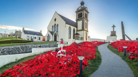 Mairi Grant Macduff Parish Church poppy display wider shot with path