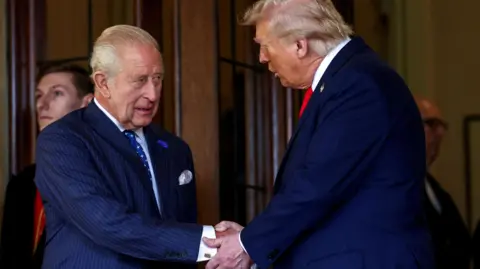 King Charles and President Trump shaking hands