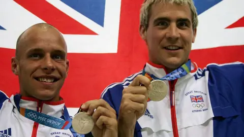 Getty Images Silver medalists Peter Waterfield and Leon Taylor of Great Britain celebrate on the podium during the medal ceremony 