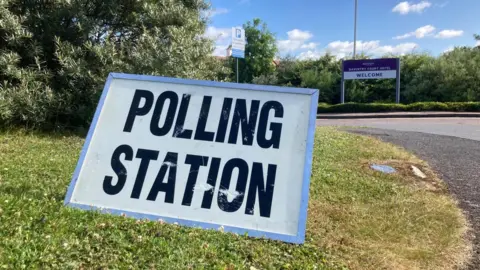 BBC Polling station sign on grass in Daventry