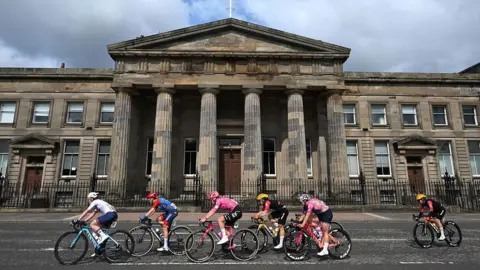 Getty Images Cyclists race past the High Court in Glasgow 