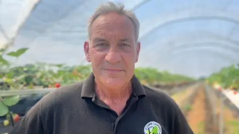 Steve Kember in a polytunnel at a farm in Goudhurst