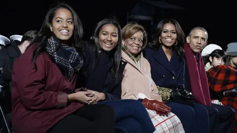Getty Images Robinson with Barack, Michelle, Malia and Sasha Obama