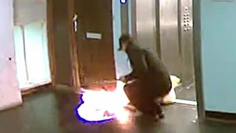 Craig McQuillian setting fire to the front door