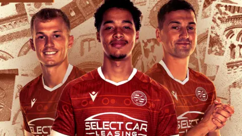 Reading players wearing the new kit in front of a collage background made up of images of the town hall.