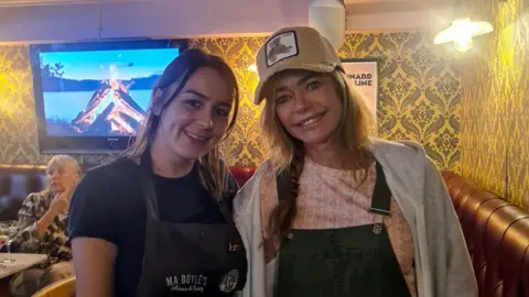 Ma Boyle's Both deputy manager of Ma Boyle's Amy Kelly and Hollywood star Denise Richards smiling during her visit to the restaurant.
