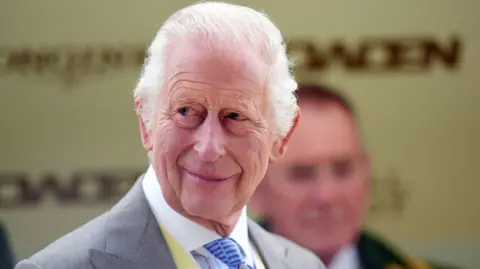 PA Media King Charles III smiling