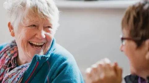 Two women laughing
