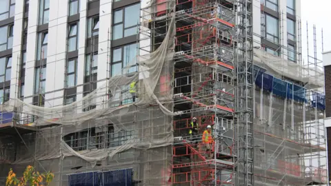 Reuters A general view of a high-rise public housing building with new cladding applied to its exterior, in the Chalcots Estate in the Swiss Cottage area of north central London within the Camden Borough, Britain November 8, 2024