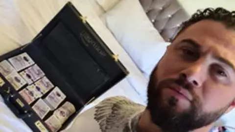 CPS Gyumesh Ali and a briefcase of cash