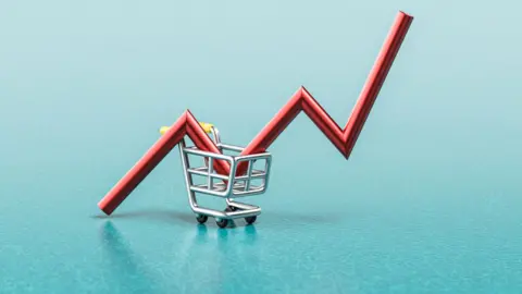 Getty Images Photo of a tiny shoppping trolley with a red arrow which goes upwards 