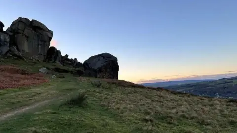 Julia Bryson/BBC Ilkley's Cow and Calf rocks at sunset