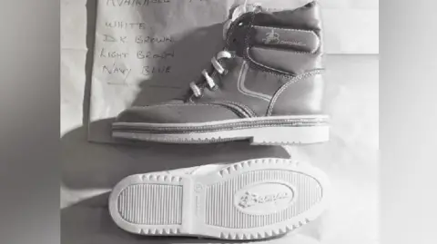 Kent Police A boot and a boot sole. Both have "banana" written on them