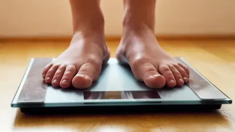 a person standing on scales