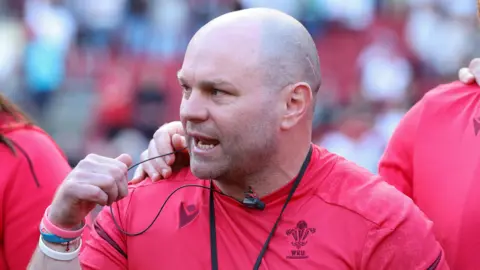 Sean Lynn in a Wales huddle