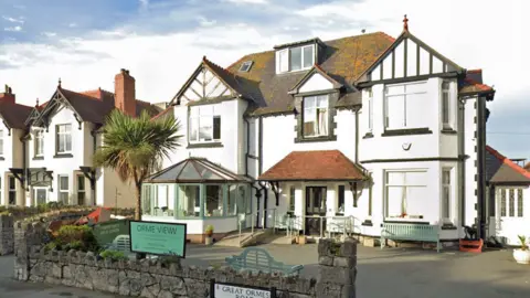 Google Double fronted Orme View care home, Llandudno, painted black and white