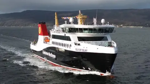 Oliver Brindle A black and white ferry on water with Caledonian MacBrayne written on it, with Isle of Islay written near the front 