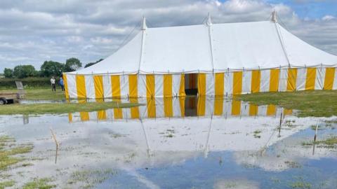 Show tent surrounded by water
