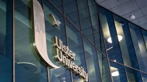 Getty Images A building with large windows. A sign with the words 'Ulster University' is in the centre of the image. 
