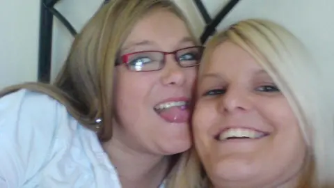 Chloe Callaghan Bethan Callaghan (right) picture with her sister Chloe Callaghan. Chloe has dark blonde hair with a side fringe and wears pink rectangle rimmed glasses. She has blue eyes and pokes her tongue out at the camera. Bethan has brown eyes and bright blonde hair. She looks directly at the lens and smiles widely.