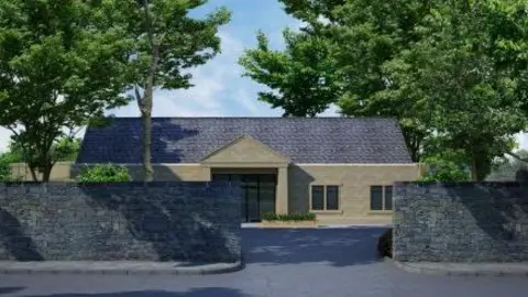 HB Architectural Services An artist impression of a single‑storey stone building set behind a tall stone wall that runs along the front of the property. The building has a dark, slate‑coloured pitched roof and a central entrance area with a small overhanging porch supported by angled columns. Large windows flank the entrance, and additional windows are visible on the right side of the structure.
