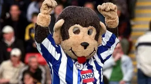 PA Media H'Angus the Monkey, who was elected as Hartlepool mayor in 2002