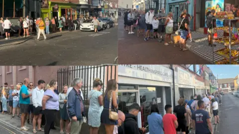 People queueing outside shops