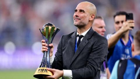 Pep Guardiola of Manchester City celebrates with the FIFA Club World Cup Trophy