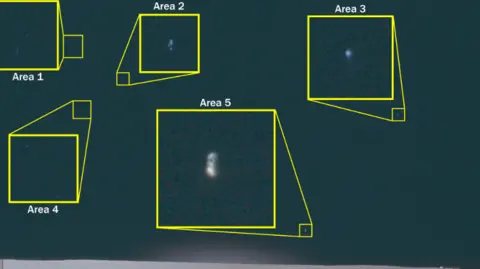 A black sky with small white dots highlighted in yellow boxes