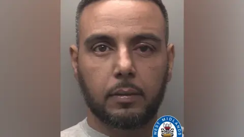 West Midlands Police Police mugshot of Shazad Alam wearing a grey top